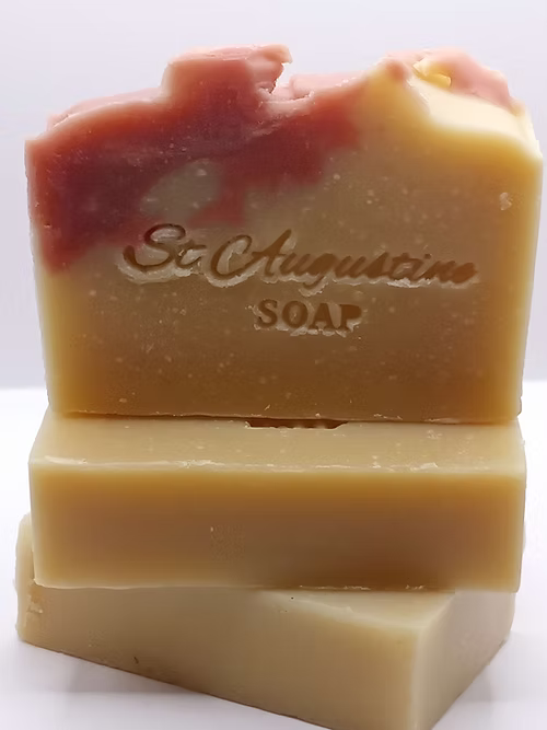 Stack of St. Augustine soap bars on a white background